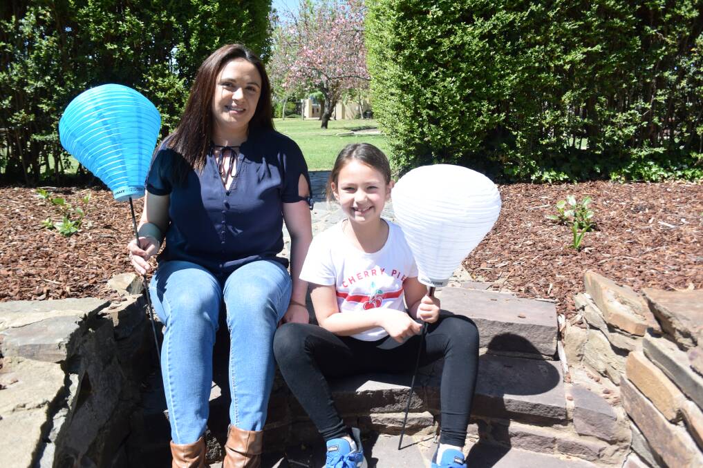 SYMBOLIC LANTERNS: Rachelle Mintern and her daughter Taylor Garrett, 8, are ready for Saturday's Light the Night at Victory Memorial Gardens. Picture: Annie Lewis 