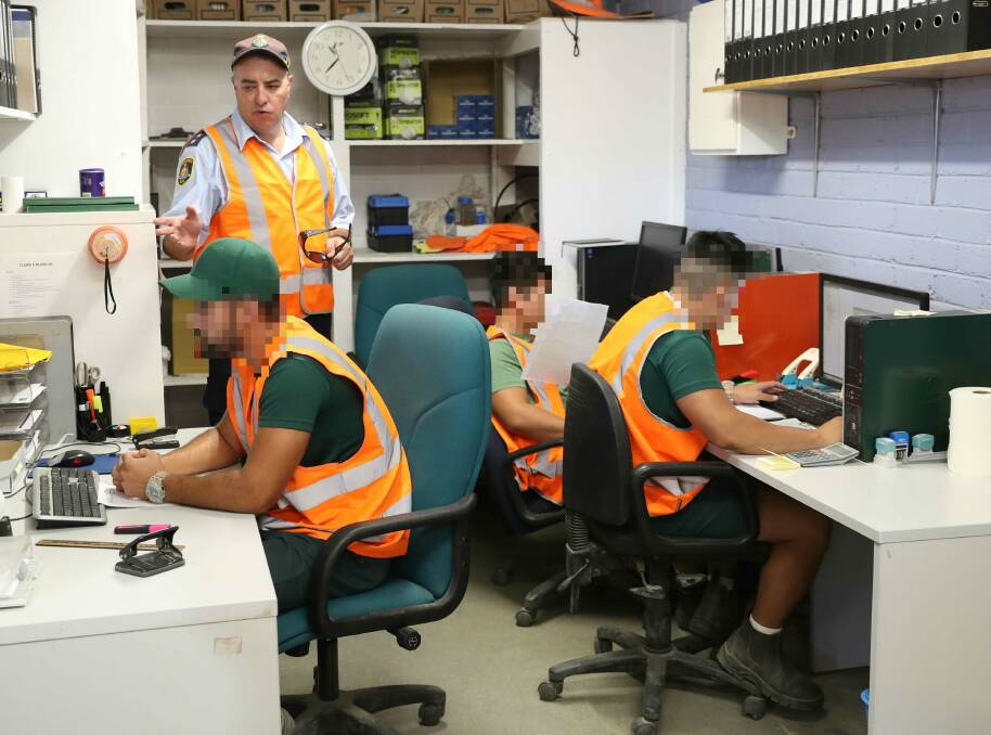 OFFICE WORK: Brad Jeffreys says some of the inmates run the administrative side of operations ensuring productions continue without a hitch. Internet access is barred from computers. Picture: Les Smith