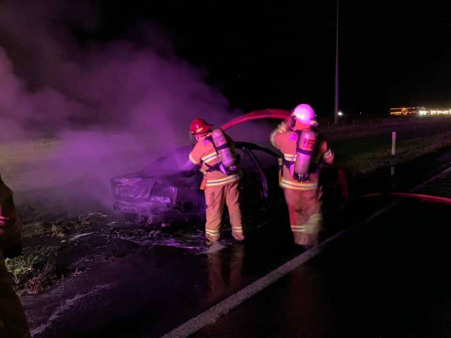 Firefighters work together to extinguish a car fire on the Sturt Highway. Picture: Forest Hill Rural Fire Brigade 