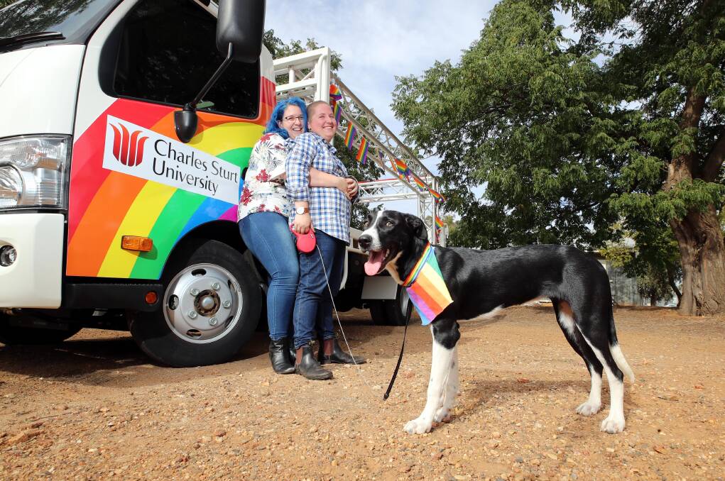 BRIGHT FLOAT: Ruby Fox and Jesse Lindell with their dog Storm are readying themselves for Wagga's Mardi Gras. Picture: Les Smith 