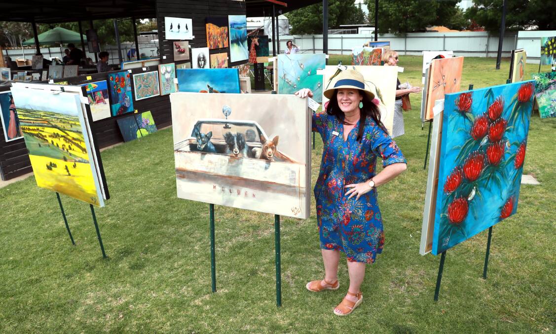 FAIR FOR A CAUSE: Wagga artist Kylie van Tol with one of her many paintings for sale. This one is called 'Let's Ride'. Picture: Les Smith 