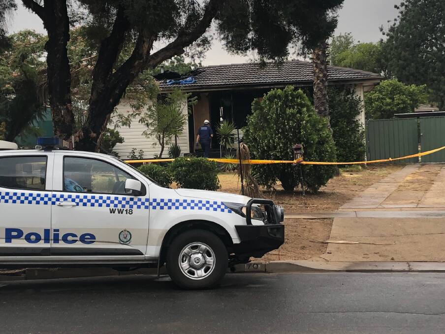 Police establish a crime scene at the home in Mumford Street, Ashmont. Picture: Annie Lewis 