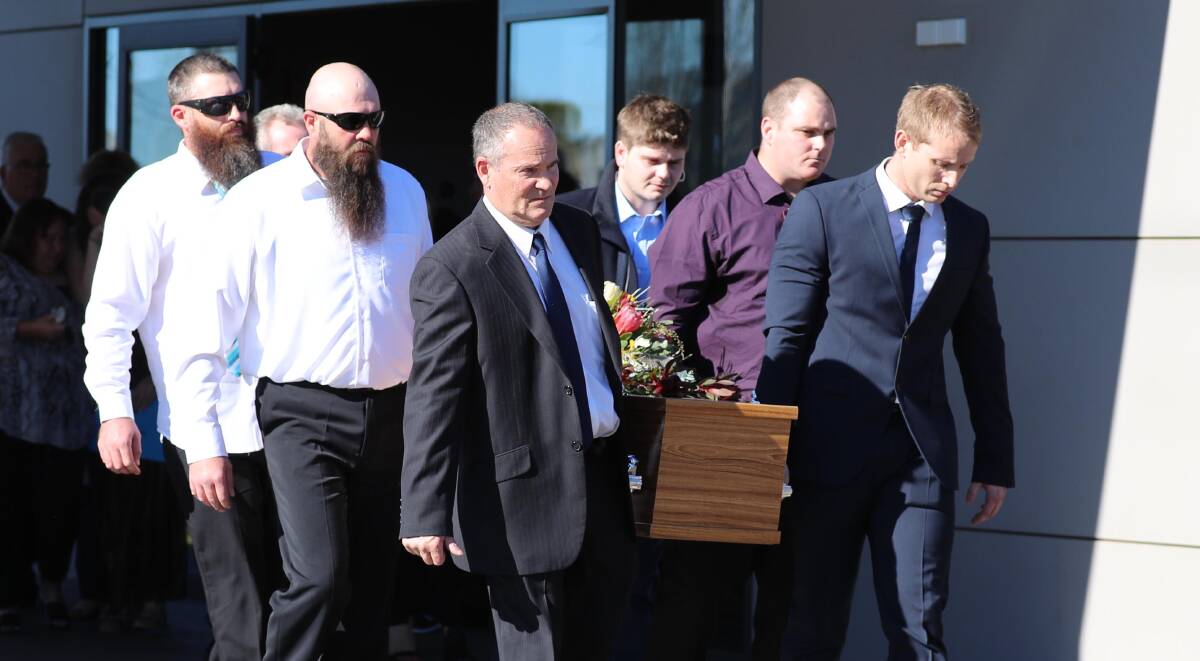 REST IN PEACE: Steve Schreiber's coffin is carried out by pallbearers, including his dad, brother and friends. Picture: Les Smith 