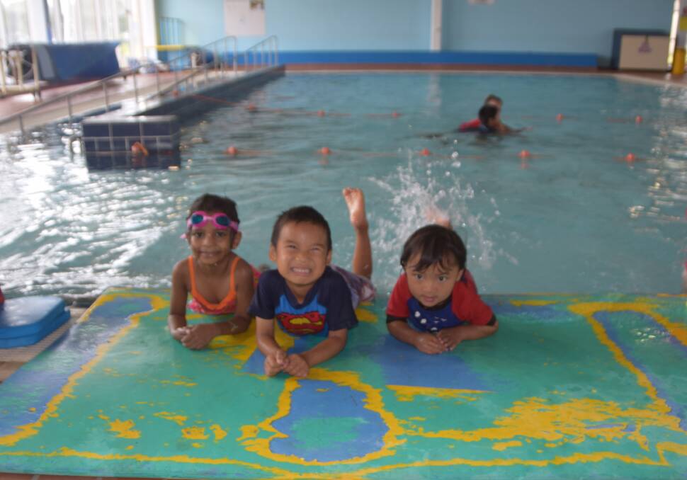 EAGER LITTLE LEARNERS: Symphonym Maximilian Gaw and Yenuli Hathurusinghe love learning how to kick and float in the water. 