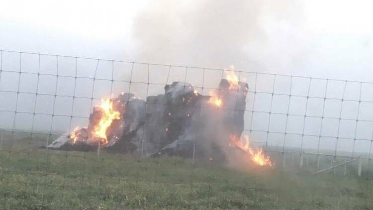  Moments after the hay stack caught alight in Gumly in September. 