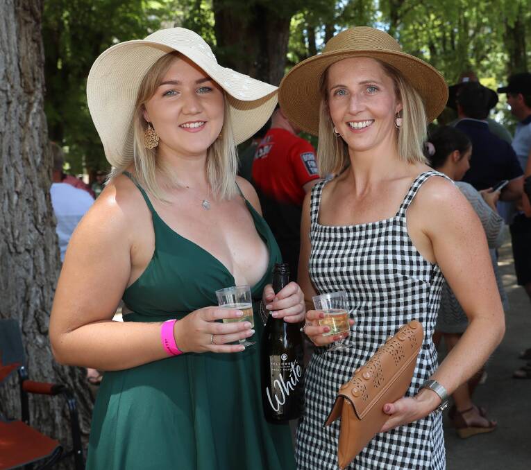 ALL SMILES: Amy Corkery from Queanbeyan and Jess McLennan from Tumut at the Boxing Day Races. Picture: Les Smith 
