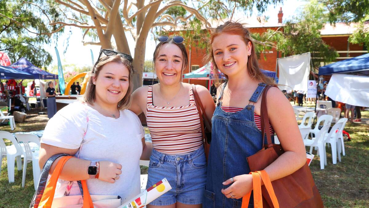 ALL SMILES: Chloe Moore, Bessie Lawrence and Abbey Lyon enjoying roaming CSU's Orientation Week stalls. Picture: Emma Hillier 