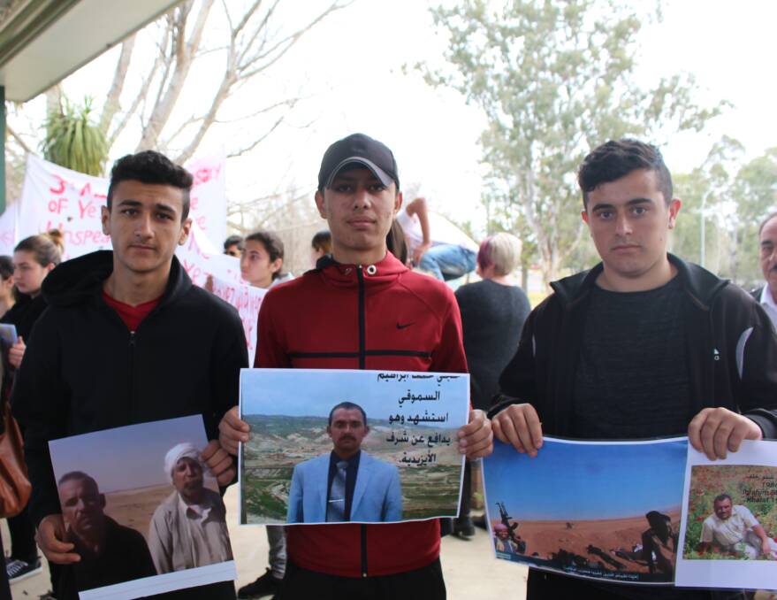 IN REMEMBRANCE: Salah Khudauda, Qasim Aoso and Mahdi Sulaiman hope for international aid. Picture: Annie Lewis 