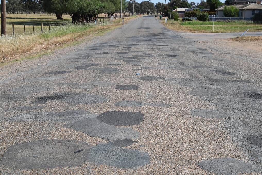 DEPLORABLE ROADS: Baker's Lane is riddled with potholes. Picture: Emma Hillier 