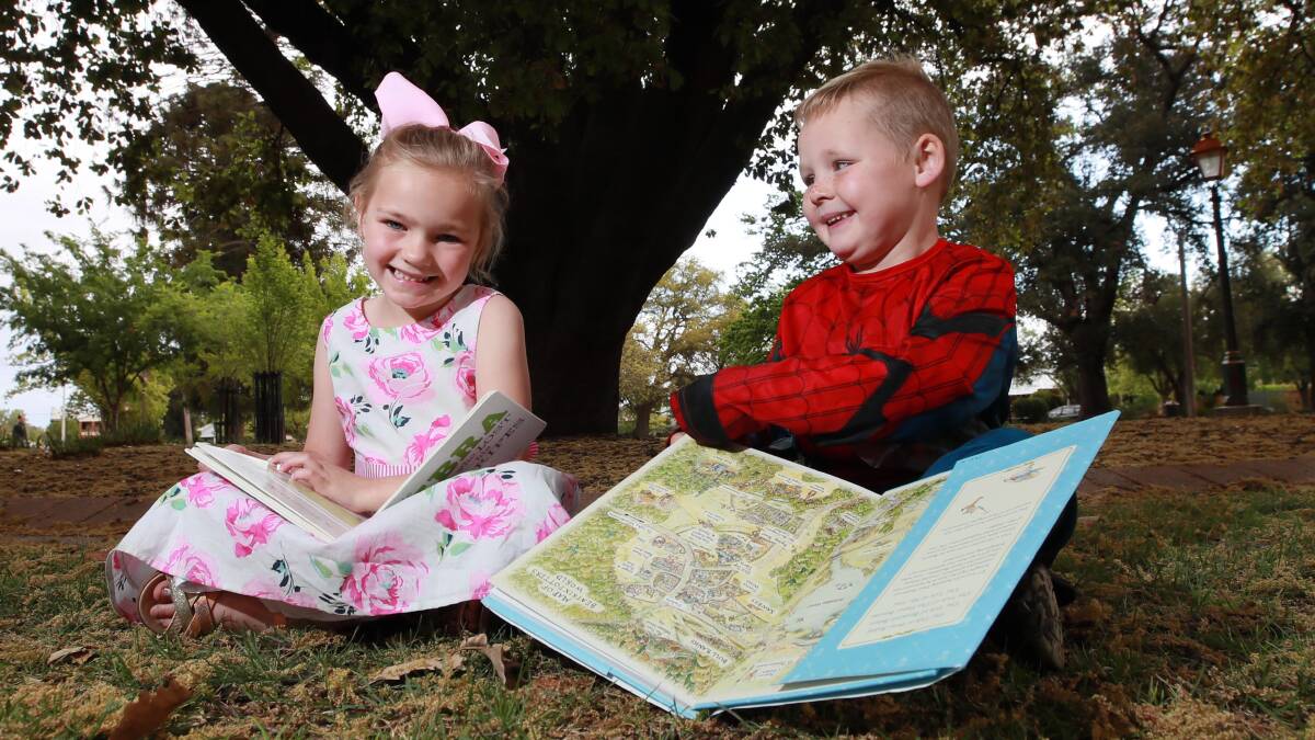 FINDING TREASURES: Mercede Prowse, 5, and Max Debritt, 3, happily sit down with their spoils from Collins Park. Picture: Les Smith 