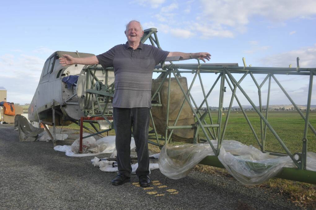 BRINGING THEM HOME: Ron Fisher with the fuselages of the Wirraway and Winjeel after they arrived in Wagga on Monday. Picture: Toby Vue 