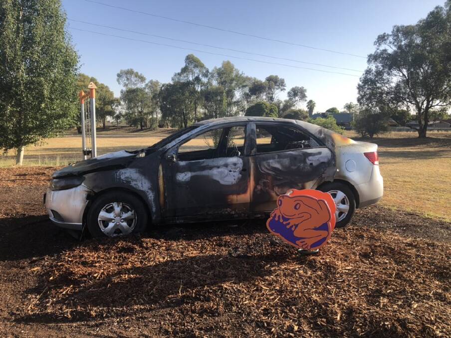 A car was set alight in a children's playground in Glenfield Park on Tuesday morning. Picture: Annie Lewis 