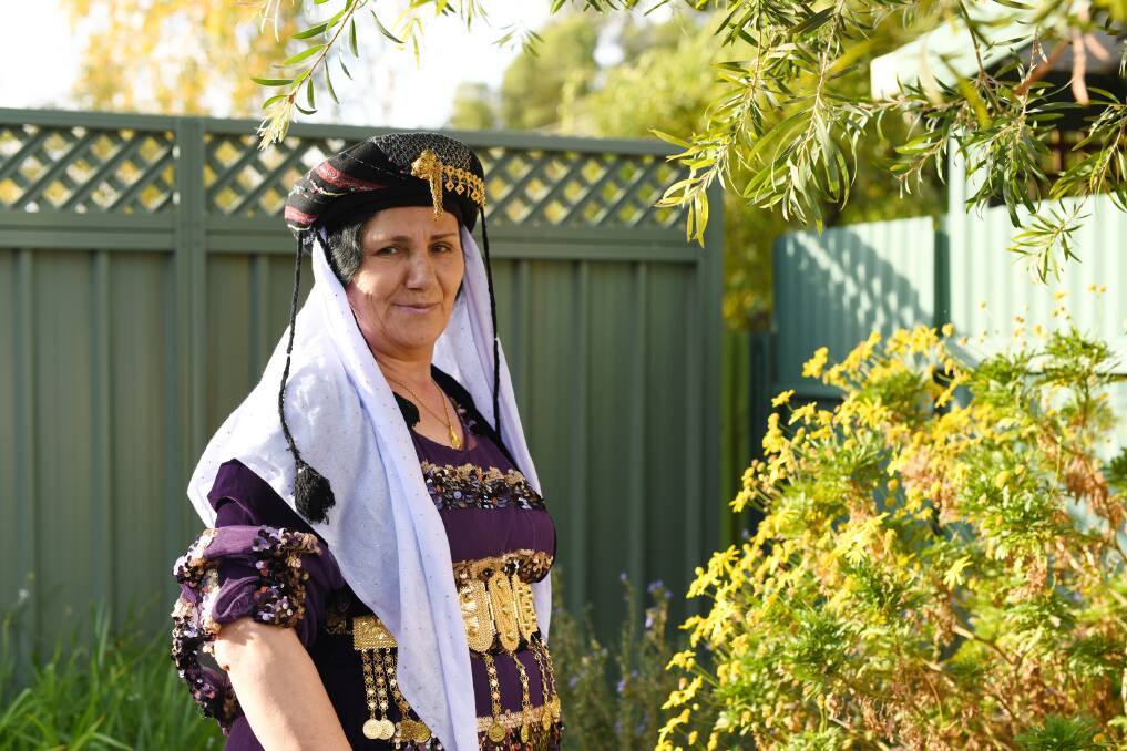 SHOWING HER HERITAGE: Farzo Saleem is proud to wear the traditional dress of the Yazidi religion. Ms Saleem arrived in Wagga in August 2016 after fleeing Iraq. 