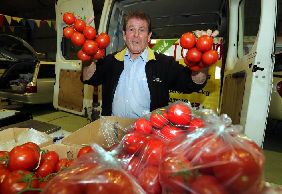 FRESH PRODUCE: Tony Caccamo with his home-grown tomatoes that he usually sells from a shed at his Bourke Street home. Picture: Les Smith 
