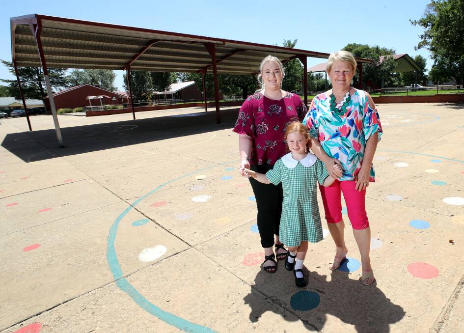 FAMILIAR FACES: Alarna McBeath with her old kindergarten teacher, Donna O'Grady, who is now teaching her daughter Piper McBeath, 5. Picture: Les Smith 