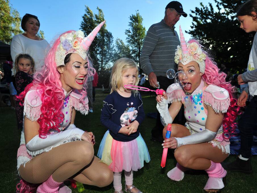 READY TO CELEBRATE: Eadie Goode, 2, with the bubble-blowing unicorns, at Fusion18. 