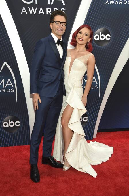 WINNERS: Bobby Bones and Sharna Burgess were awarded the Dancing with the Stars Season 27 Mirrorball trophy on Monday night. Picture: Charles Sykes/Invision/AP 