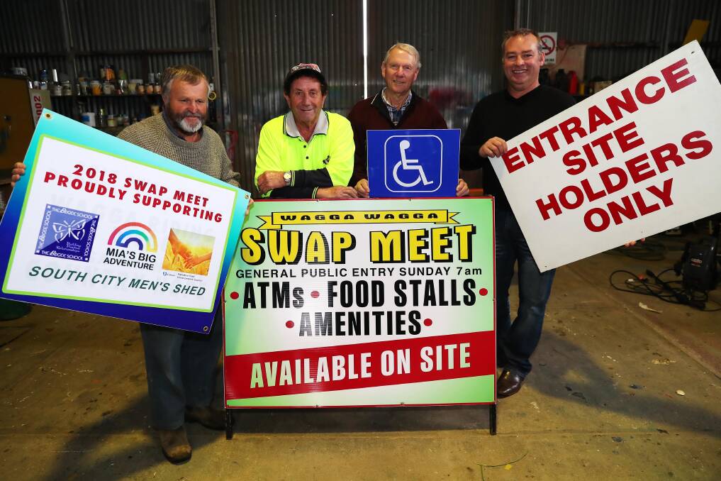 PREPARATIONS: Getting the signs ready for this year's meet with Robert Jacques, Des Gibbs, Gordon Saggers and David Lawrence. Picture: Emma Hillier 