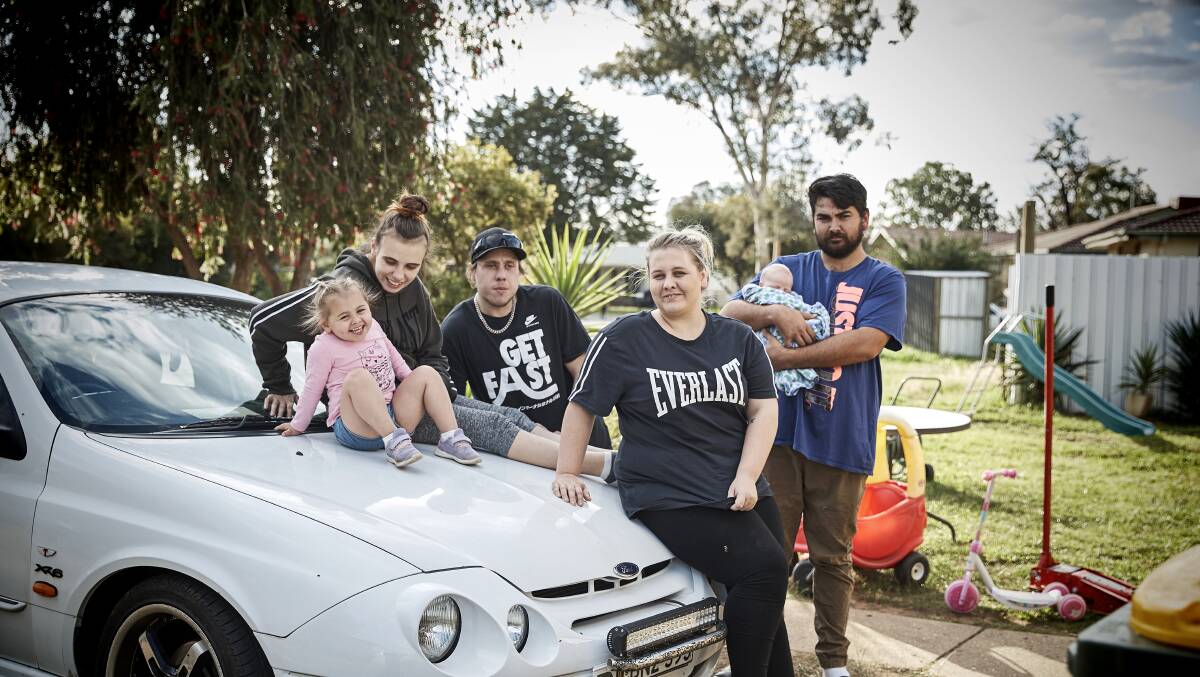 THEIR STORY: Mason and Katherine with their two-year-old daughter, Suzianna, and friends. The pair face difficulties living in Tolland. Picture: Supplied 