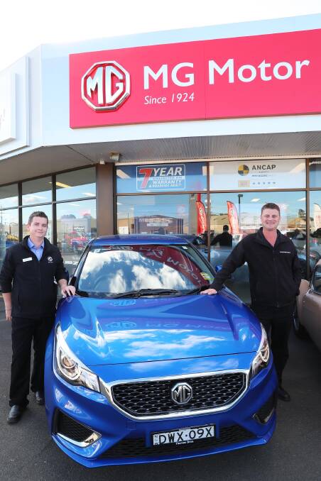 CAR FANS: Adam Nelson and Adam Humbert stand with some of the newer models of the MG cars. Picture: Emma Hillier 