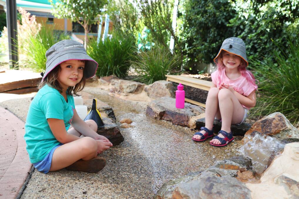 IT'S A WARM ONE: Grace Gilholme, 4 and Chloe Burman, 4 beating the heat. Picture: Emma Hillier