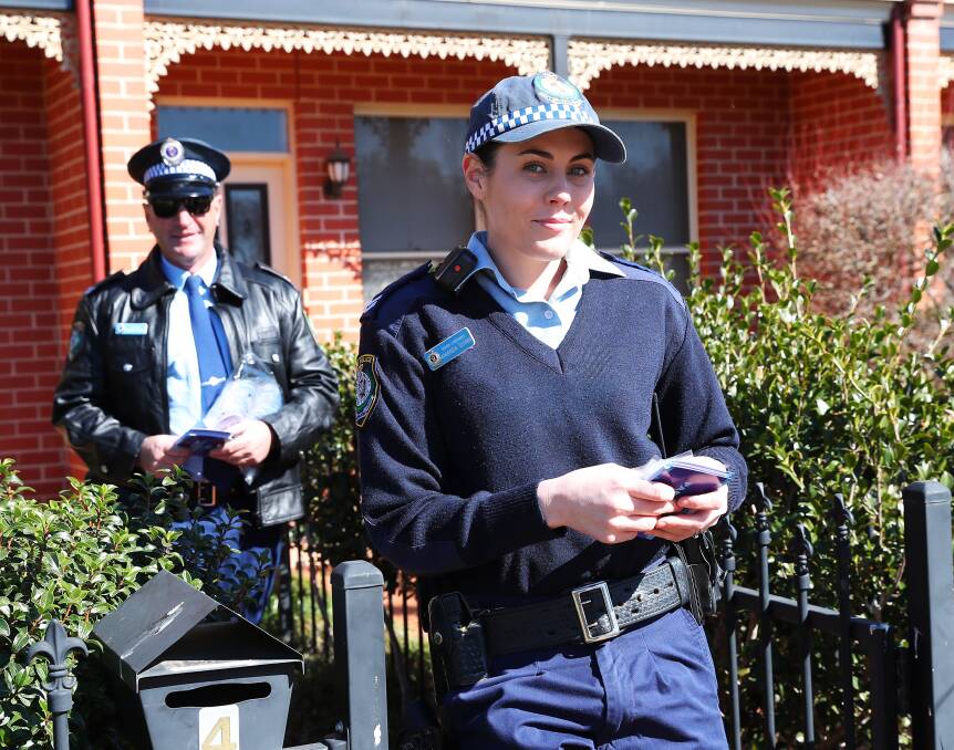 OUT IN THE COMMUNITY: Senior Constable Timothy Bourke and Senior Constable Amanda Quinn door-knock to raise awareness. Picture: Emma Hillier 