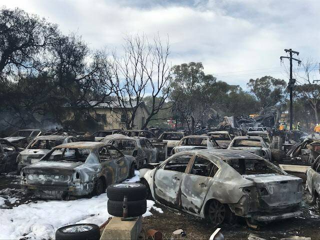 IN FLAMES: 100 cars have been burned outside Junee as a fire ripped through on late Saturday. Picture: NSW Rural Fire Service 