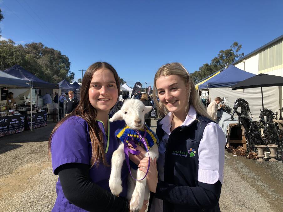 OUT AND ABOUT: Kyla Walmsey and Joella Ion with Sam the Lamb. Picture: Annie Lewis
