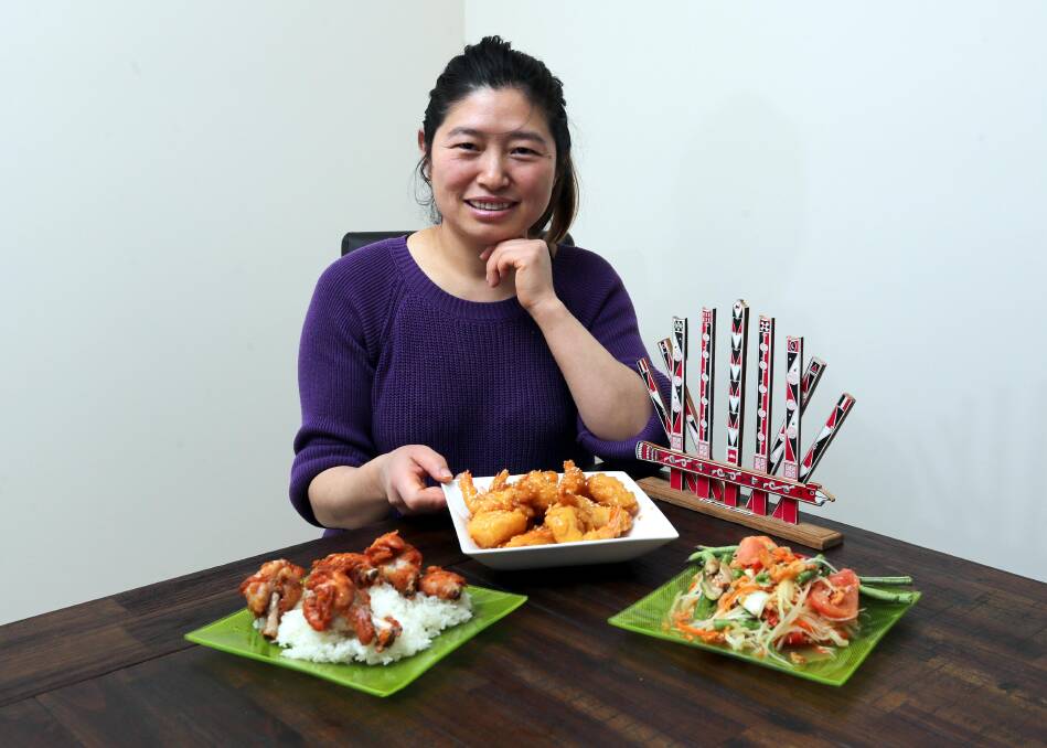 CONNECTING WITH CULTURE: From fried chicken and sticky rice to pawpaw salad and honey prawns, Achin Mayit loves to cook. Picture: Les Smith 