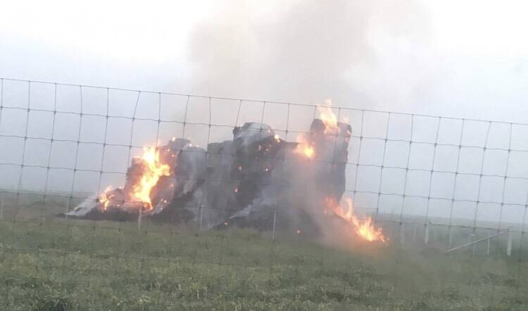 Moments after the hay stack caught alight on Saturday morning. 