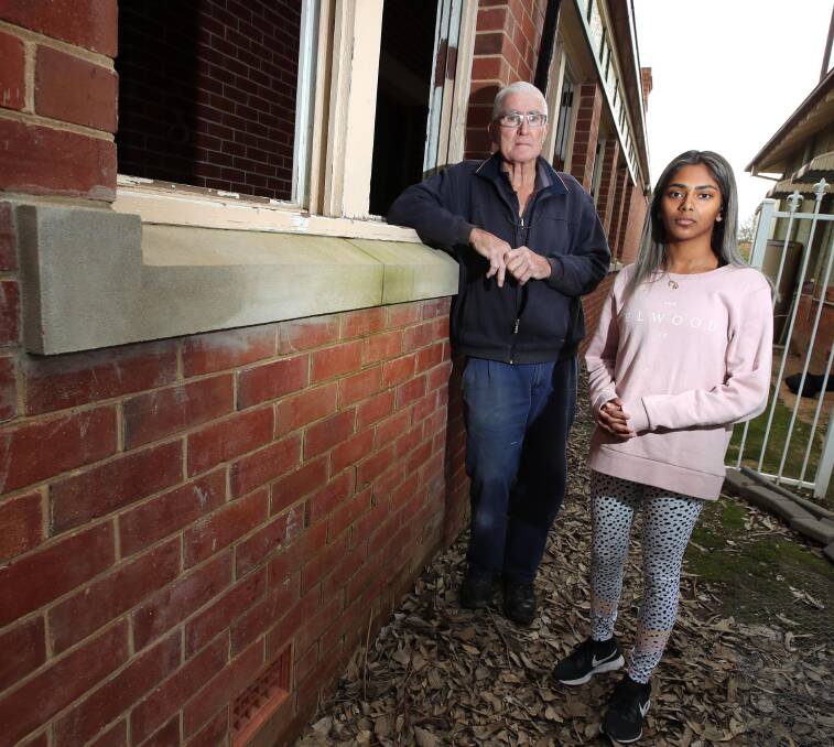 ROBBED: Ken Dwyer and his daughter Sarah. Ken had hoped to pass his mother's treasured collection onto his two daughters one day. Picture: Les Smith 