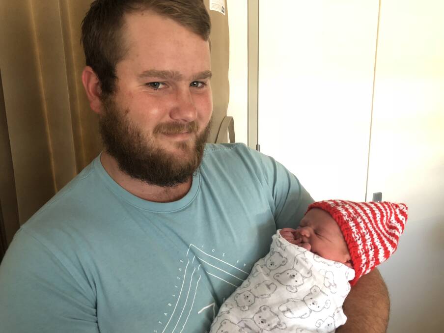 PROUD FATHER: Ignus Ferreira with his new-born son Liam who was born in the early hours of Christmas morning. Picture: Annie Lewis 