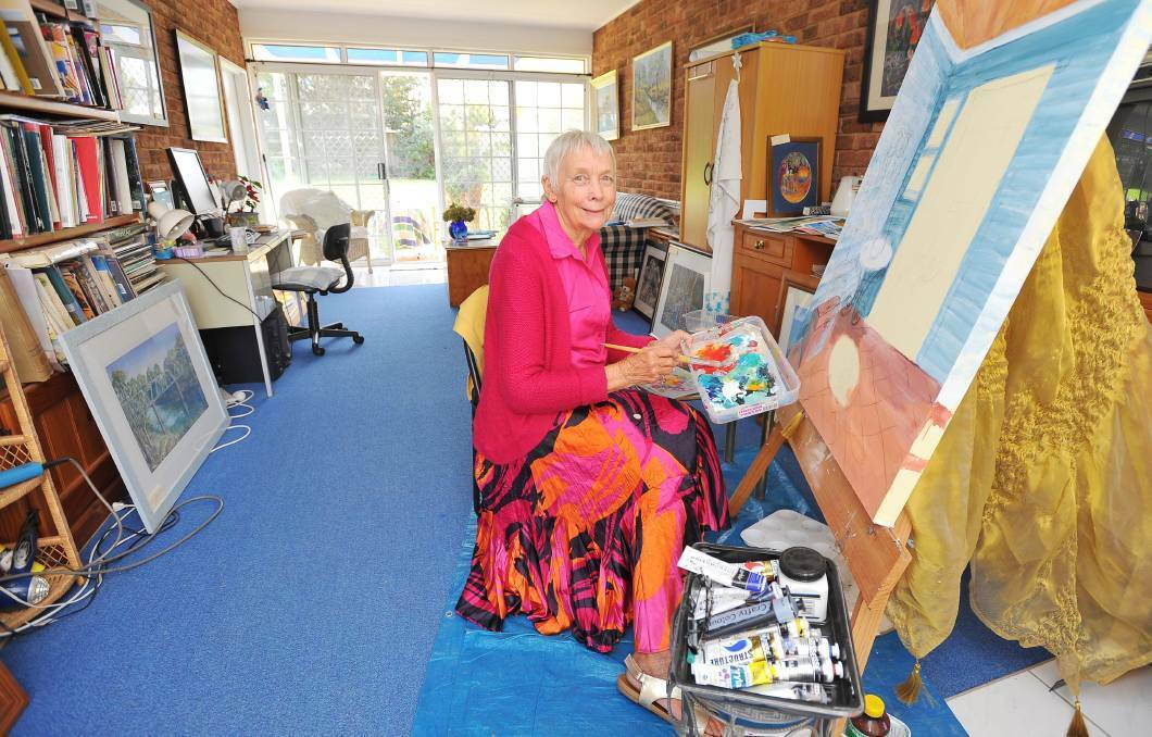 ART ADVENTURE: Wagga painter Sylvia Bamberry in her studio for the 2016 Wagga Art Trail, welcoming visitors to witness her magic in motion.
