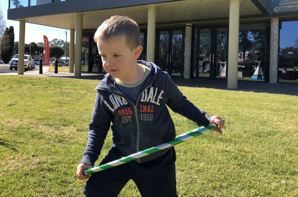 Thomas Whillock, 4, tries out a hula hoop, one of the "old-school" games that will be offered in the chill-out zone at Spring Jam.