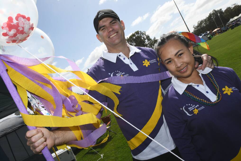 BRIGHT COLOURS: Andrew Moreland and Sar Moreland proudly don their purple jerseys for the relay. 
