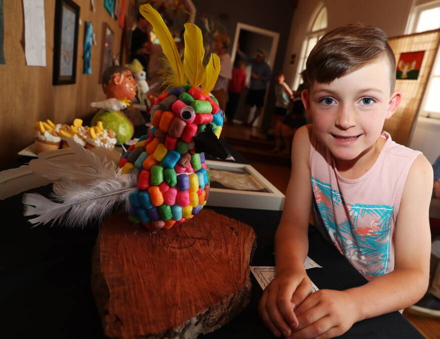 COLOURFUL CREATION: Joey Rake, 7, was not afraid to use bright colours to create his artwork. Picture: Emma Hillier 