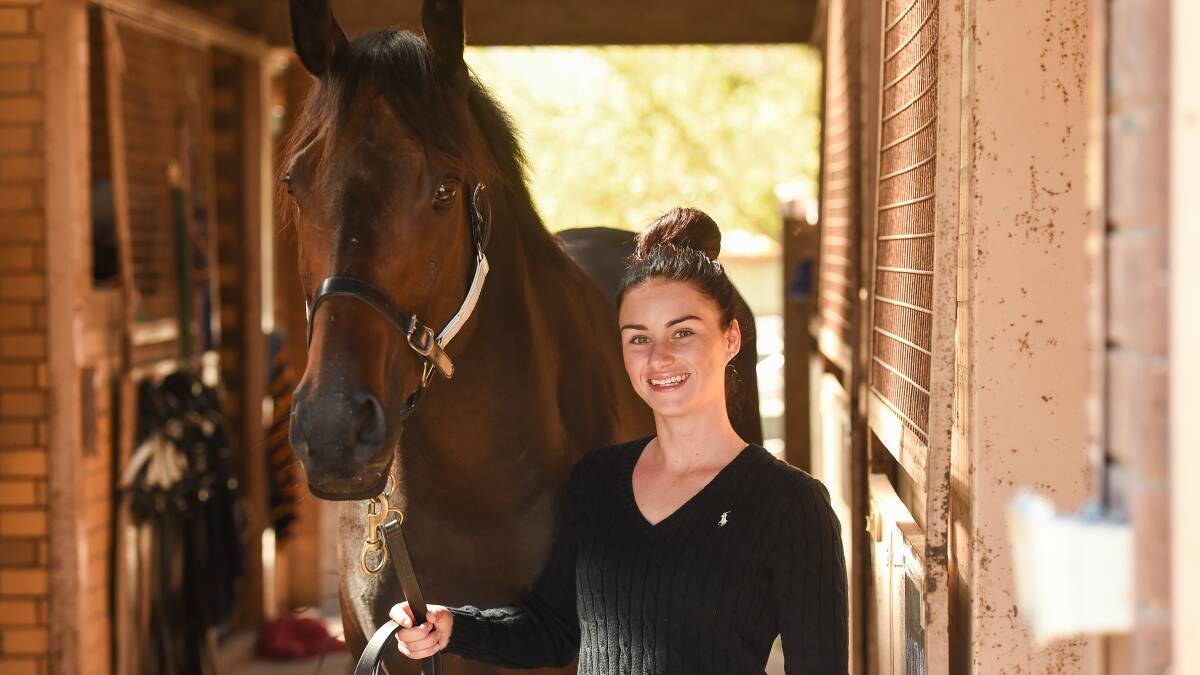 WAITING GAME: Danielle Scott with Lord Von Costa who is trained by her mother, Donna and among the leading chances in the Wagga Town Plate.