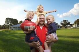 Henty forward Shannon Terlich with his three daughters Ruby, 7, Claire, 4 and Hazel, 2, ahead of his 200-match milestone on the weekend. Picture by James Wiltshire