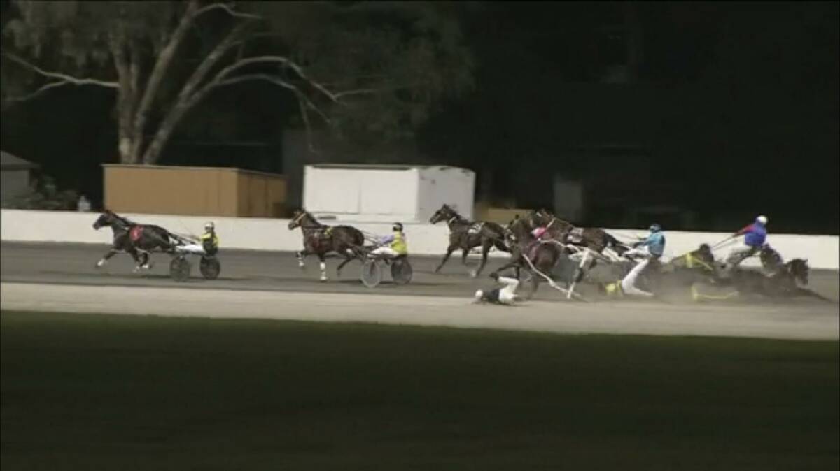 SHOCKING: The three-horse fall at the Albury Paceway on Tuesday night.