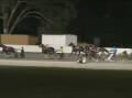 SHOCKING: The three-horse fall at the Albury Paceway on Tuesday night.