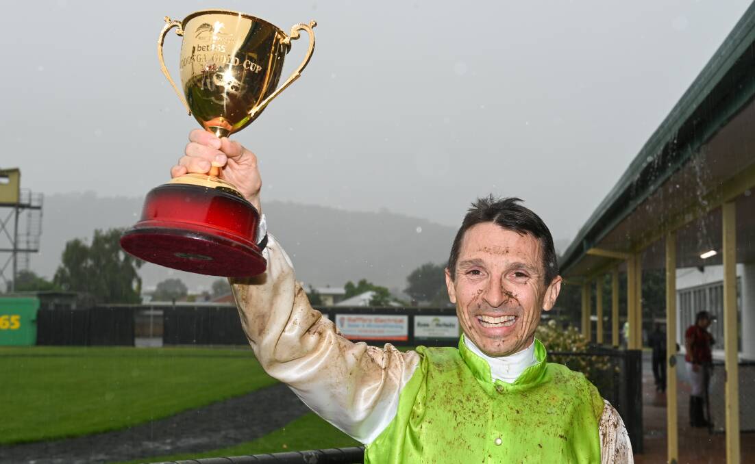 Jockey Danny Beasley with the spoils of victory after winning his second Wodonga Gold Cup on Friday aboard Another One. Picture by Mark Jesser