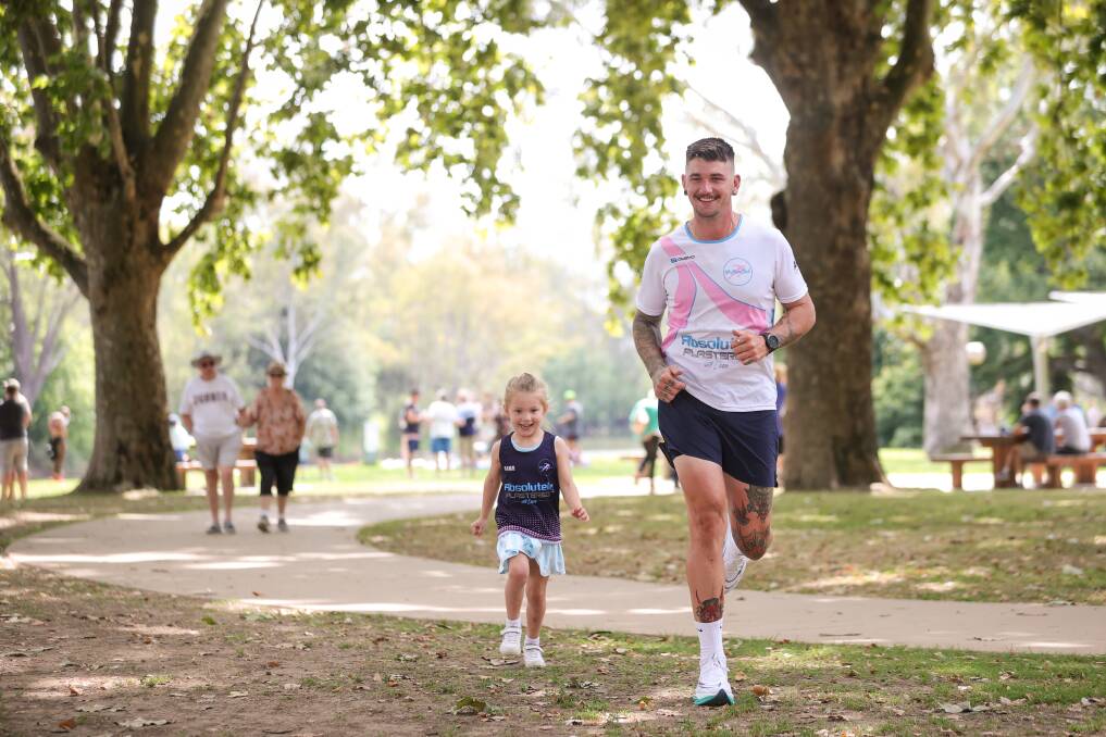 Albury's Daniel Boswell, with his daughter Eden, 4, is setting himself to run 100 kilometres in a single day in March in support of his niece. Picture by James Wiltshire