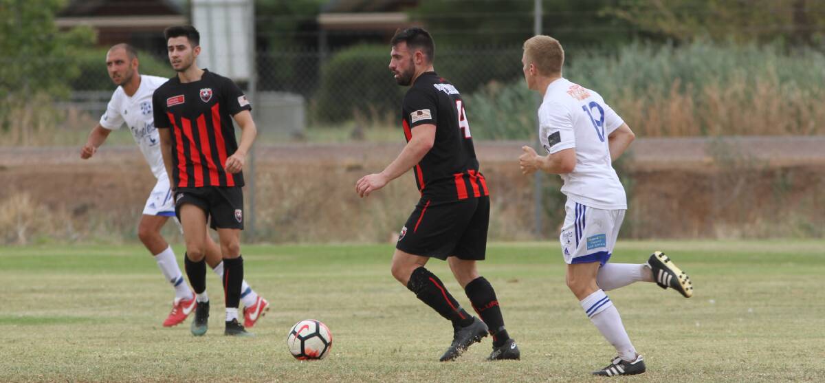 CONCENTRATE: Leeton United's Joey Fondacaro searches for options during the trial match against Hanwood a fortnight ago. Photo: Talia Pattison