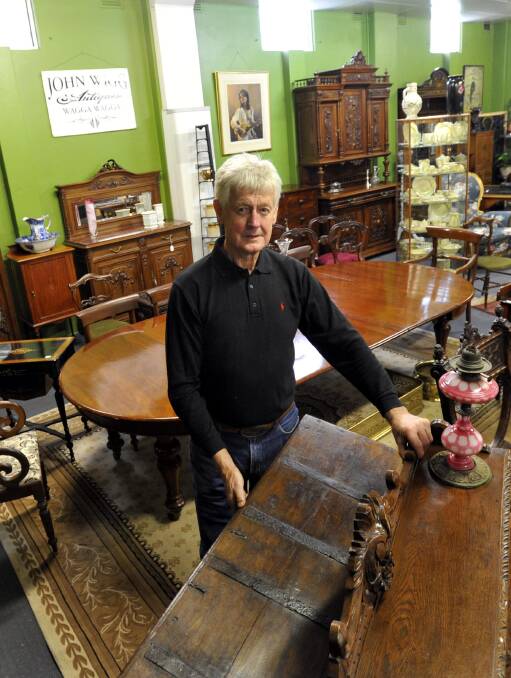 AN OLD HAND: John Wigg has reopened his antique shop and says old furniture is not past its use by date. Picture: Les Smith
