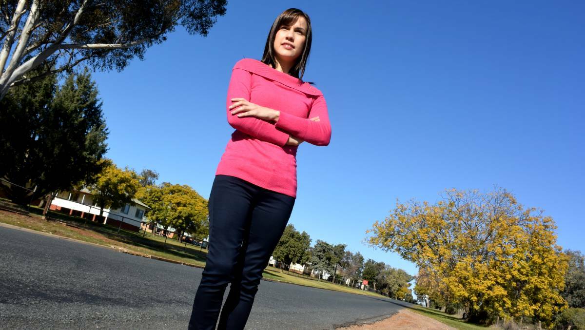 FINALLY: Crash victim Stephanie Smyth revisits Pine Gully Road, which is set to have its speed limit dropped.