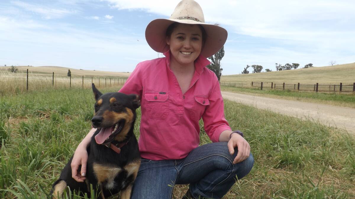 NEVER BEEN BETTER: Lauren Goldsworthy on the family farm with her dog, Tim, nearly one year after receiving a double lung transplant. Picture: Supplied