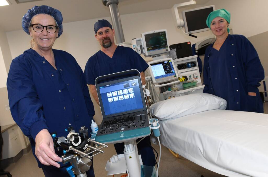 Riverina Day Surgery's Megan King, Gerard Reagan and Dani McIntyre with the new Transperineal Biopsy Machine using for diagnosing prostate cancer. 