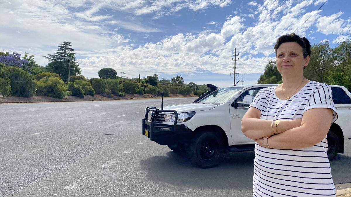TRAFFIC NIGHTMARE: Bourkelands resident Kate Lloyd standing at the intersection of Berembee and Red Hill roads. Picture: Daina Oliver