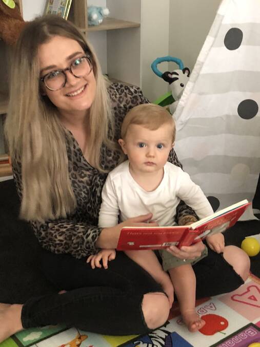 STORY TIME: Corinne and Nate Sheppard reading a book at home. Picture: Daina Oliver
