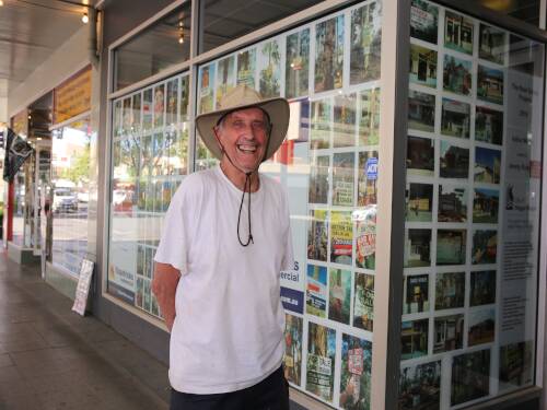 Renowned Wagga artist Arthur Wicks standing in front of his artwork on Baylis Street titled The Real Estate Project. Picture: Contributed